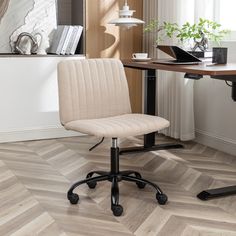 an office chair sitting in front of a desk