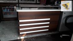 the counter top is made out of wood and has white stripes on it's sides