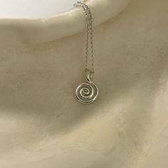 The spiral is an ancient symbol of evolution and one of the oldest symbols in existence. It is often seen to represent the navel of the universe and symbolises the cycles of life, growth and change. Spirals are often also used as a symbol of protection. Beautiful swirl pendant made of sterling silver, great for layering.  Jewellery features ~  ~ pendant measures 8.5 x 13mm  ~ bolt clasp fastening  ~ trace chain 1.1mm Old Symbols, Spiral Pendant, Ancient Symbols, Gold Vermeil, Evolution, Swirl, Jewelry Necklace Pendant, Silver Gold, Jewelry Necklaces