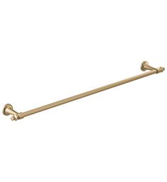 an antique brass towel bar on a white background