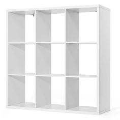 a white bookcase with four shelves on each side