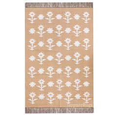 a beige and white rug with flowers on it