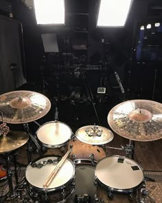 a drum set up in a recording studio