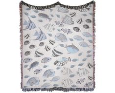 a white and blue blanket with fish on it