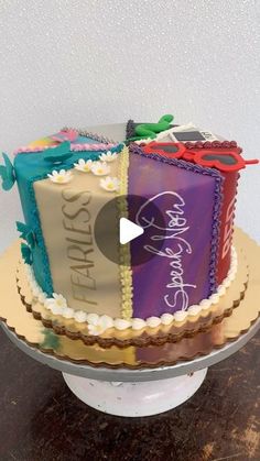 a cake that is sitting on top of a table and has the words happy birthday written on it