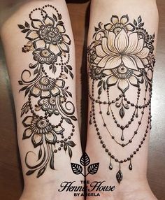 two legs with hendi tattoos on them, one is black and the other is white