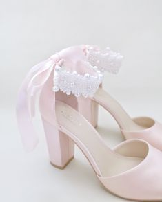 Satin block heel evening sandals adorned with all over pearls ribbon strap. Elegance and feminine inspired wear for your special day. The delicate pearl beads are placed to create a graceful classic style. Simple and easy wear for wedding guest, bridesmaids, holiday party, wedding parties, and any special occasions.DETAILS:HEELS: 3.75 inchesUPPER: Synthetic upper and liningMATERIALS: Manmade outsoleORIGIN: Imported Shoes Short Heels, Wedding Bride Shoes, Elegant Chunky Heels, Shoes For Brides, Off White Shop, Something Blue Wedding, Short Heels, Wedding Guest Shoes, Evening Sandals