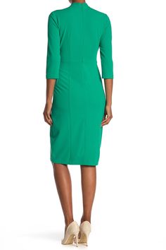 A twist neckline and sheath silhouette with hidden back-zip closure unite to make the perfect day-to-night three-quarter sleeve dress. 43" length (size 8) Twisted neckline 
 Three-quarter sleeves 96% polyester, 4% spandex Machine wash cold, line dry 
 Imported Model stats: 5'10", 32" bust, 25" waist, 36" hip. Model is wearing size 8. Green Stretch Bodycon Dress With Straight Neckline, Green Bodycon Dress With Straight Neckline, Elegant Green Bodycon Dress With Straight Neckline, Green Bodycon Sheath Dress, Green Stretch Bodycon Dress For Work, Fitted Green Dress With Side Zipper, Green Bodycon Midi Dress For Work, Green Bodycon Sheath Midi Dress, Fitted Green Dress With Back Zipper