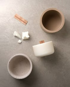 two cups, one with marshmallows and the other with toothbrushes