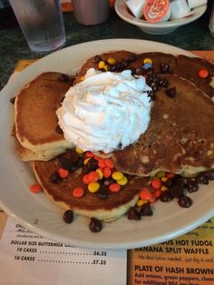 pancakes with whipped cream and chocolate chips on top