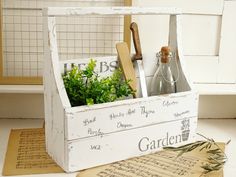 an old wooden crate filled with herbs and wine bottles