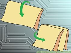 two pieces of paper with green arrows pointing to each other on top of a circuit board