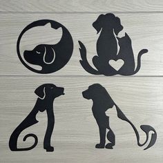 four different silhouettes of dogs sitting on top of a wooden floor next to each other