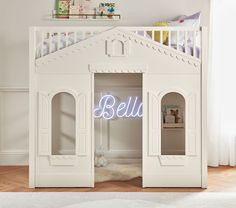 a child's bedroom with a white bunk bed that has the word hello written on it