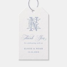 a blue and white wedding thank tag with the letter d on it's side