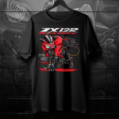 a black t - shirt with an image of a red and white robot on it