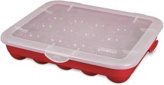 a red and white plastic container filled with lots of small balls on top of it