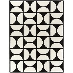 a black and white rug with circles on it