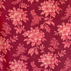 a red and pink floral print fabric