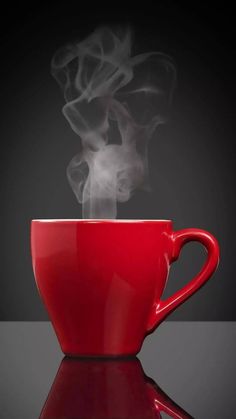 a red cup with steam rising out of it