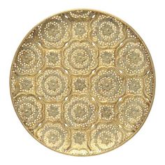 a gold plate with intricate designs on it