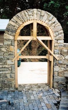 an arch made out of stone and wood