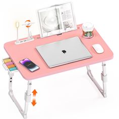 an apple laptop computer sitting on top of a pink desk with white legs and arms