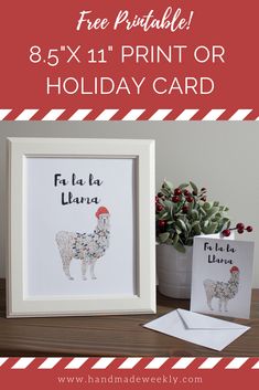 the printable holiday card is displayed next to a potted plant and two cards