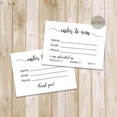 two business cards with the words enter to win written in black ink on white paper