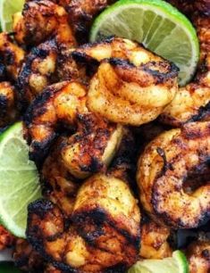 grilled shrimp and limes on a plate