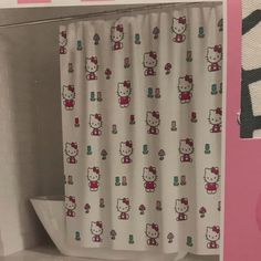 a hello kitty shower curtain in a bathroom