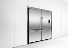 a stainless steel double door refrigerator in a white room with light floors and wall to wall cabinets