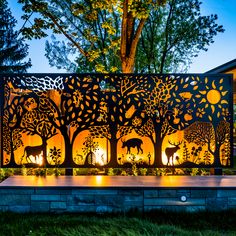 an outdoor fire pit in the middle of a yard with trees and animals on it