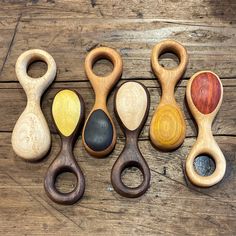 five wooden spoons with different shapes and sizes