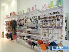 the inside of a jewelry store with lots of necklaces