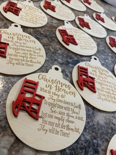 wooden christmas ornament with chinese writing and red decorations on top of a table