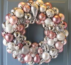 a blue and white christmas ornament wreath on a door