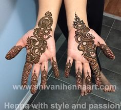 two hands with henna tattoos on them