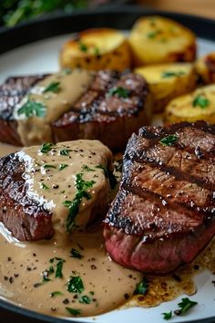 steak, potatoes and gravy on a plate