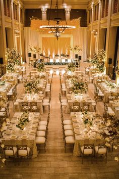 a banquet hall set up with tables and chairs