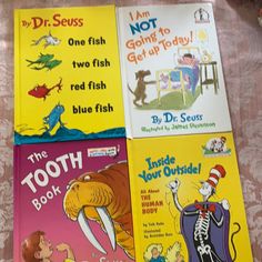 four dr seuss books on a table