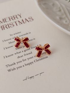 🫧 Christmas Bow Earrings 🫧 Earrings are made from Pure S925 18K Gold Plated  🤍  P E R F E C T  G I F T  F O R  H E R  🤍 * Christmas bow Earrings  * Meticulous attention to detail * hypoallergenic, nickel free & safe for sensitive skin * Perfect for bridal earrings, bridesmaid earrings or for everyday wear. 🤍 P R O D U C T - D E T A I L S 🤍 * Material: Pure 925 Silver,  * Plated: 18K Gold 🤍 W H A T ' S  I N  T H E  B O X 🤍 * Our Jewelry  * Silver Polishing Cloth * Alcohol Pads * Greeting Cheap Gold Christmas Earrings, Christmas Jewelry Aesthetic, Elegant Gold Earrings For The Holiday Season, Elegant Gold Earrings For Holiday, Christmas Earrings Aesthetic, Elegant Round Christmas Earrings, Gold Holiday Drop Earrings, Elegant Christmas Anniversary Earrings, Christmas Jewelry Gift With Matching Earrings