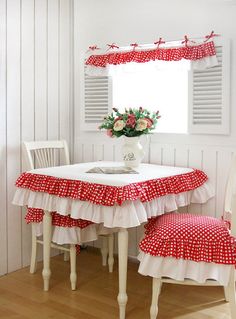 a white table with red and white polka dots on it