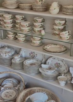 a shelf filled with lots of plates and bowls