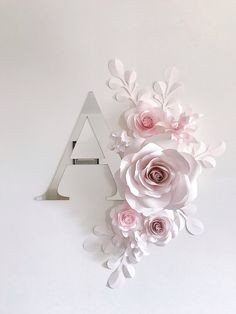 the letter a is made out of paper flowers