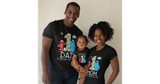 a man and woman standing next to each other wearing matching tshirts with the number one on them