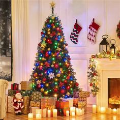 a decorated christmas tree sitting in front of a fire place with presents on the floor