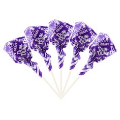 purple and white candy lollipops with the words dunkin donuts on them