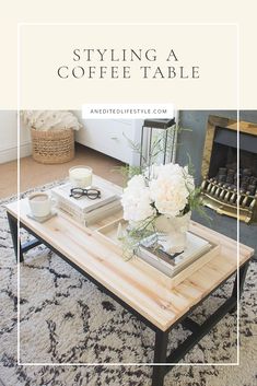 a coffee table with flowers on it and the words styling a coffee table above it