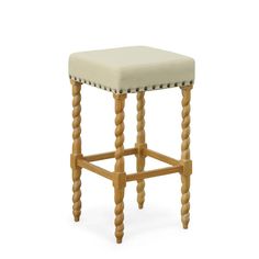 an upholstered stool with wooden legs and studded trimmings on the seat